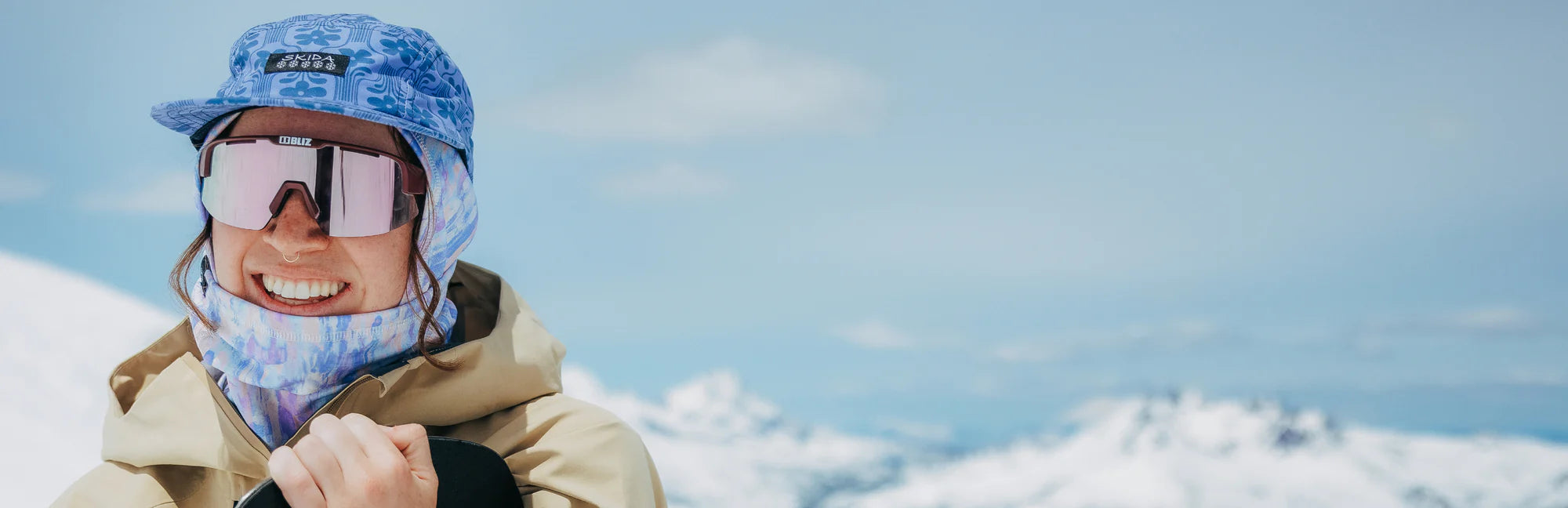 Woman Wearing Cold Weather Balaclava on Snowy Mountain Top